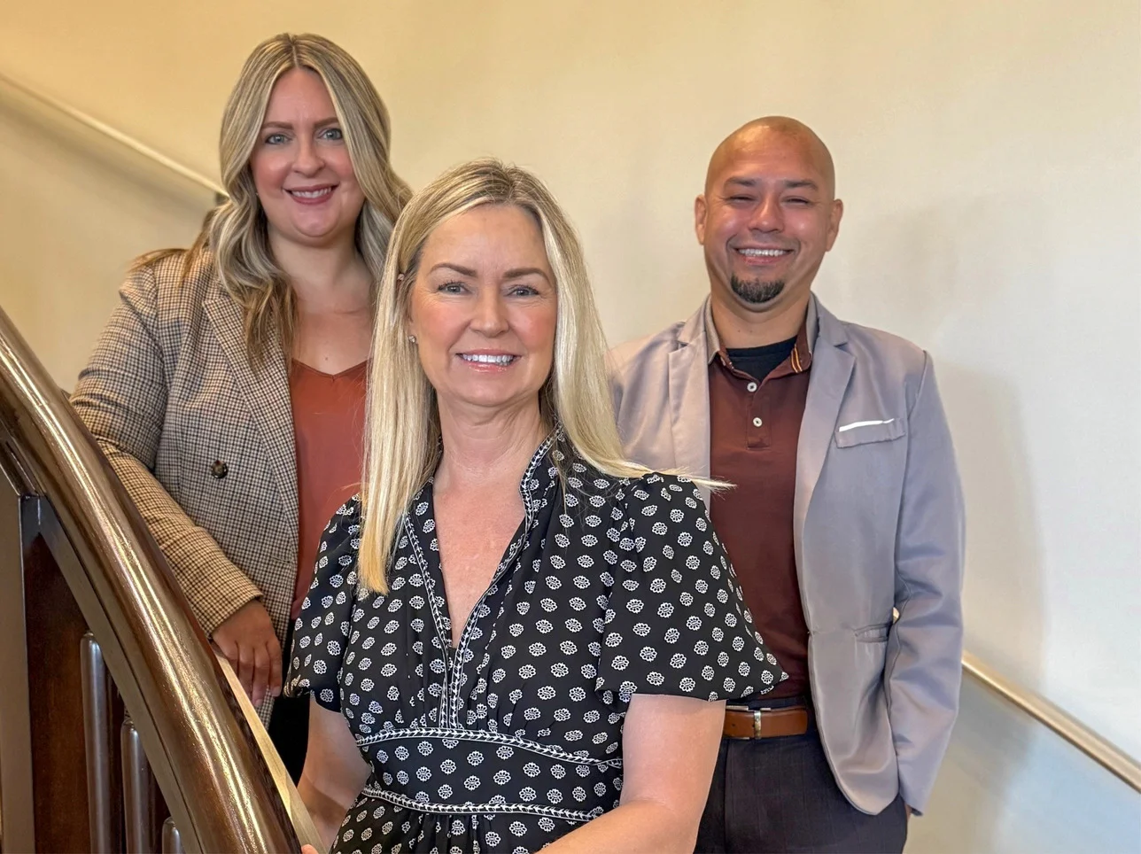 Group photo of three staff at Irell's Newport Beach office