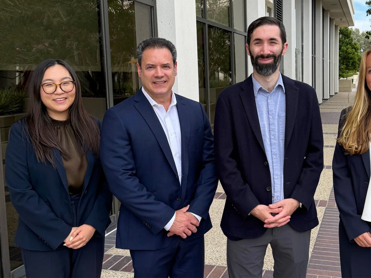 Group photo of three Irell attorneys at Newport Beach office